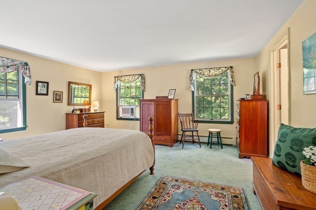 14 Rainbow Road Marblehead, MA 01945 - Photo 27 of 41 a bedroom with a bed and a dresser next to a window