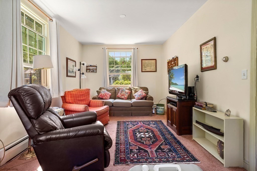 14 Rainbow Road Marblehead, MA 01945 - Photo 31 of 41 a living room with furniture a rug a window and a flat screen tv