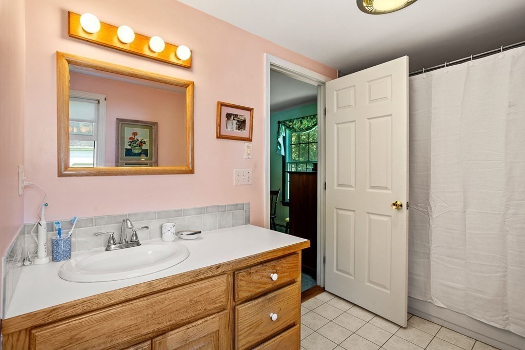 14 Rainbow Road Marblehead, MA 01945 - Photo 36 of 41 a bathroom with a sink and a mirror