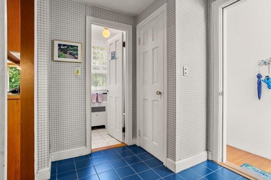 14 Rainbow Road Marblehead, MA 01945 - Photo 37 of 41 a view of a hallway with wooden floor and closet area