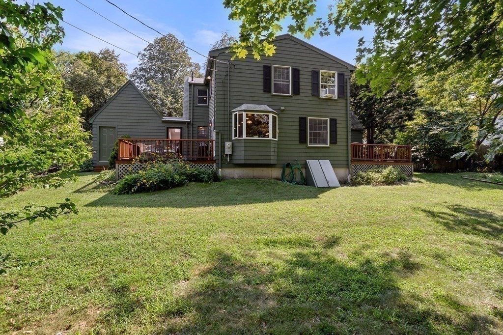14 Rainbow Road Marblehead, MA 01945 - Photo 10 of 41 a front view of a house with a yard and garage