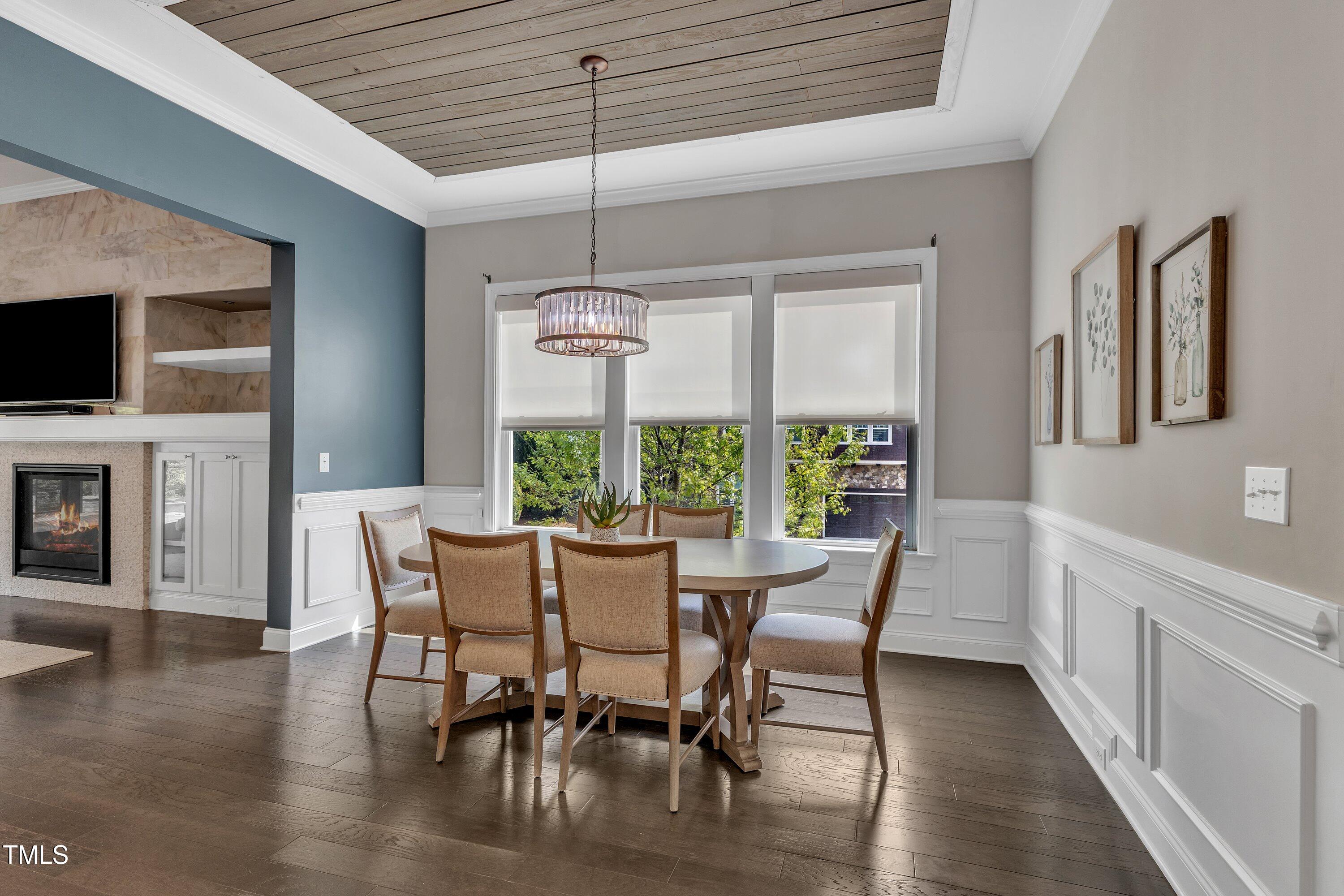 8121 Greys Landing Way Raleigh, NC 27615 - Photo 9 of 95 a view of a dining room with furniture window and wooden floor