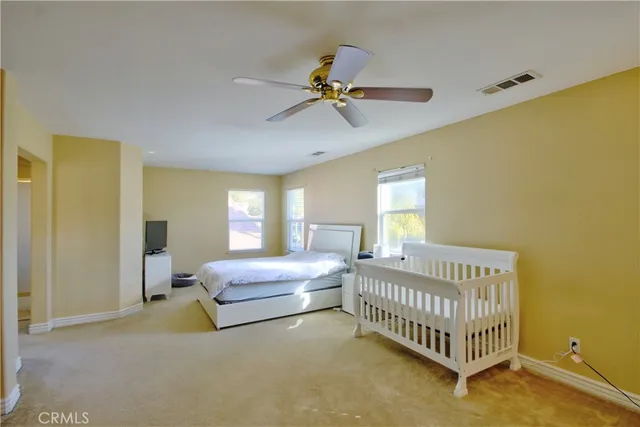 a bed room with a bed and a window