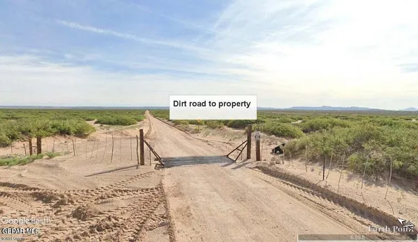 a sign board with an ocean view