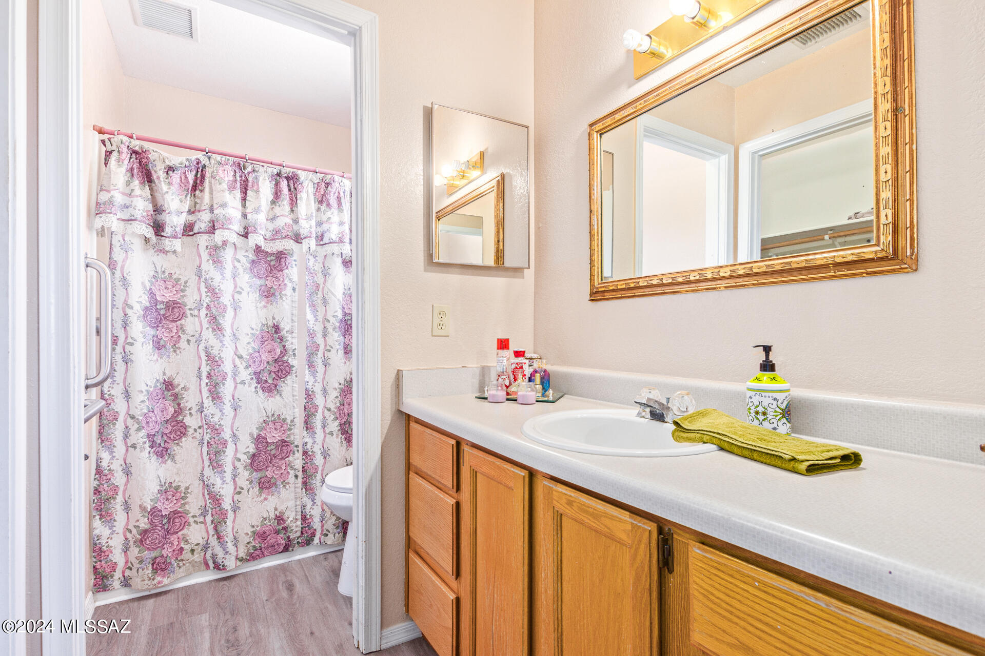 1232 Circulo Aguilar Rio Rico, AZ 85648 - Photo 23 of 32 a bathroom with a sink and a mirror
