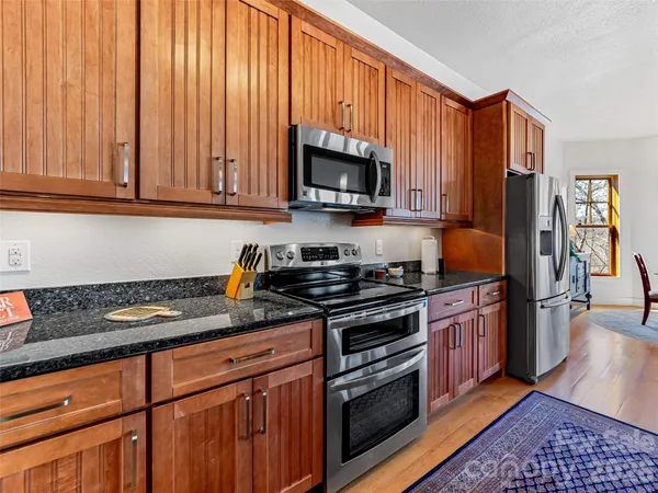a bathroom with a tub a sink and a shower