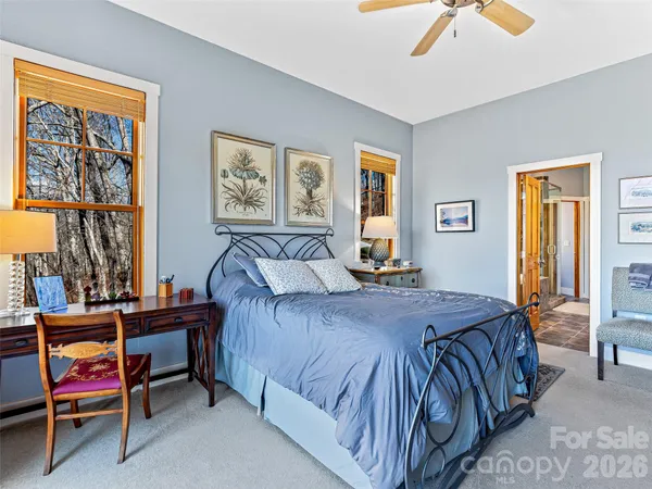 a view of walk in closet with clothes