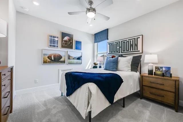 a bedroom with bed and cabinet