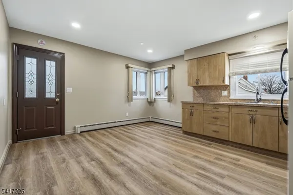 a view of a kitchen with electric appliances