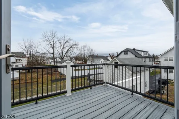 a view of a balcony with wooden floor