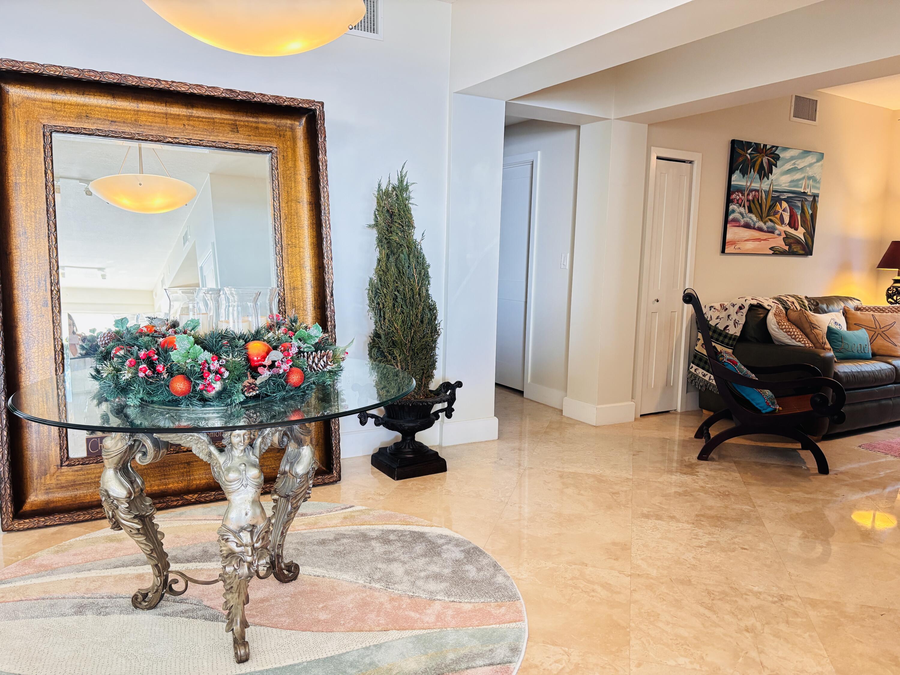 97501 Overseas Highway, Unit 521 Key Largo, FL 33037 - Photo 13 of 38 a room with furniture and flowers