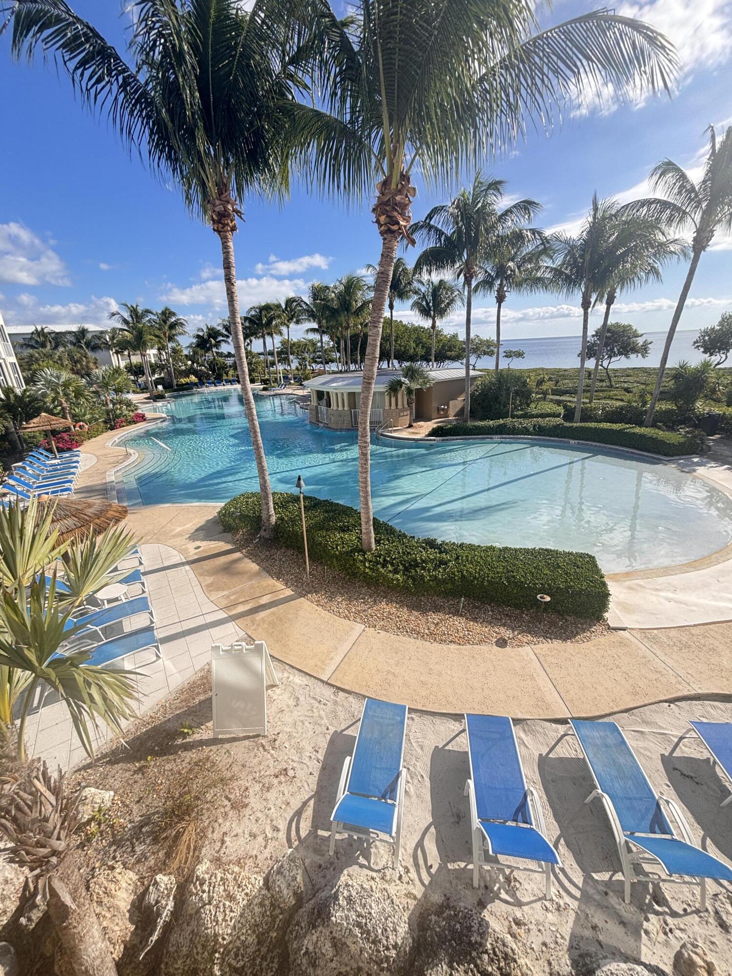 97501 Overseas Highway, Unit 521 Key Largo, FL 33037 - Photo 19 of 38 a view of a yard with a patio