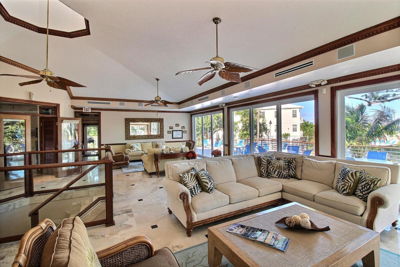 97501 Overseas Highway, Unit 521 Key Largo, FL 33037 - Photo 24 of 38 a living room with furniture a ceiling fan and a window