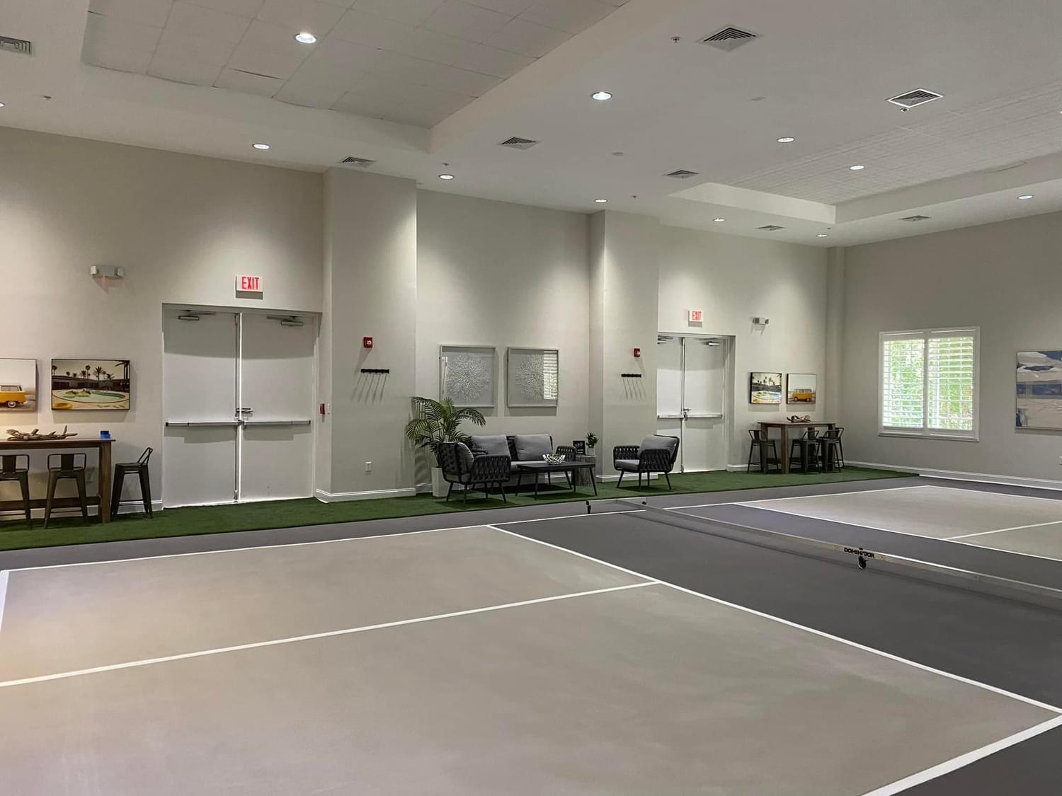 97501 Overseas Highway, Unit 521 Key Largo, FL 33037 - Photo 28 of 38 a room with lots of white furniture and a chandelier