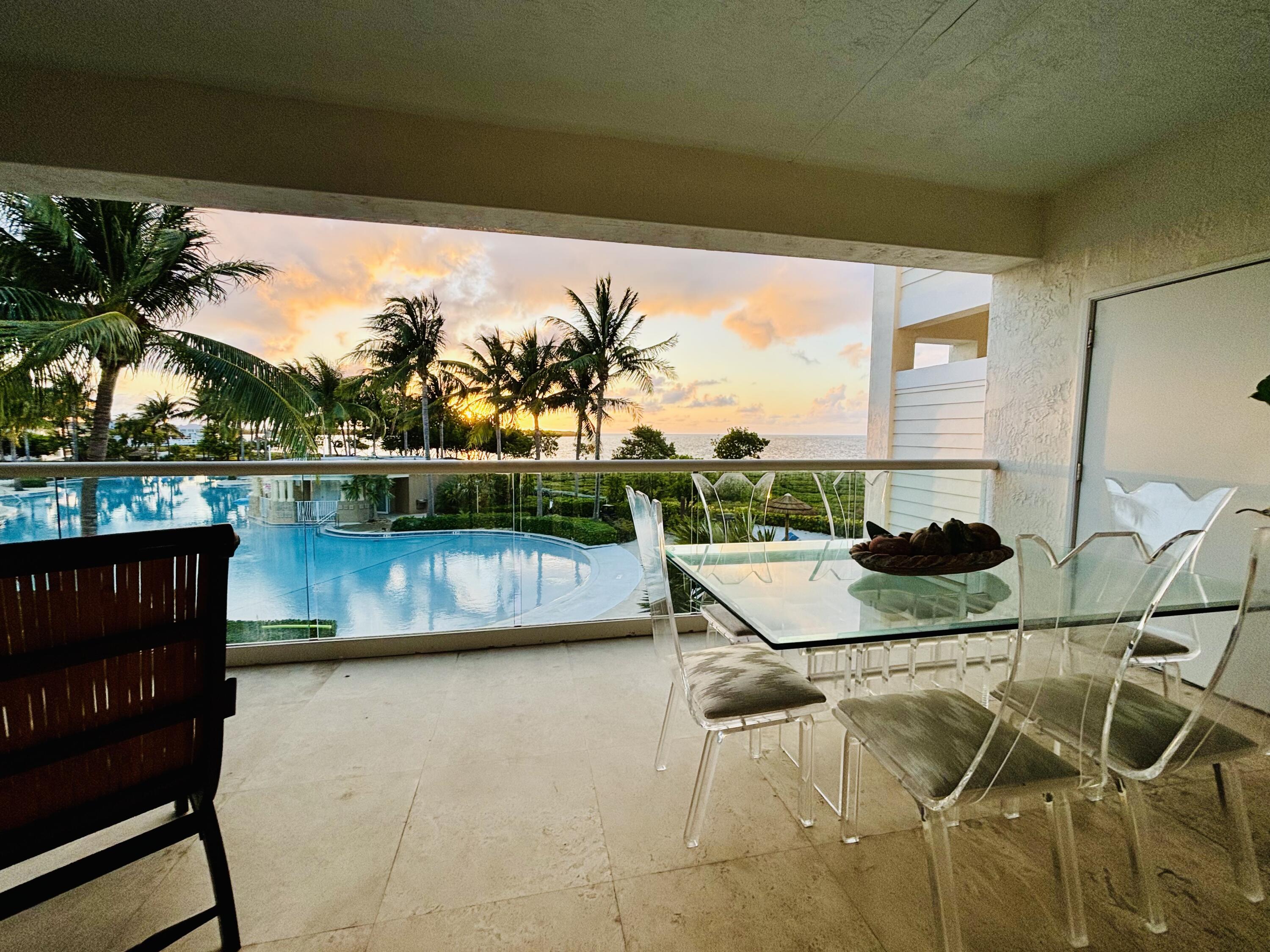 97501 Overseas Highway, Unit 521 Key Largo, FL 33037 - Photo 5 of 38 a view of a swimming pool with a lake view and sitting space