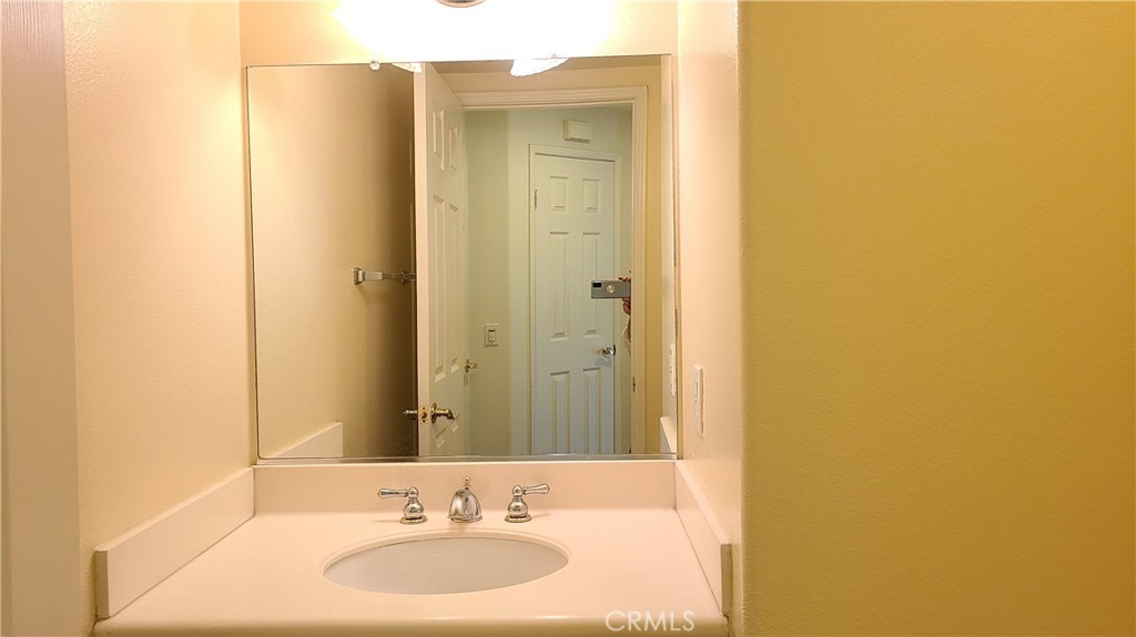 9 Garrison Loop Ladera Ranch, CA 92694 - Photo 7 of 20 a bathroom with a sink and a mirror