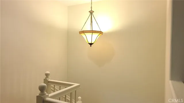 a room with a window and a ceiling fan