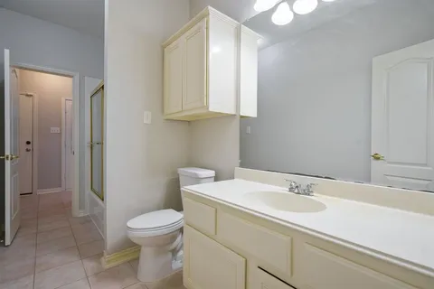 a bathroom with a sink toilet and vanity
