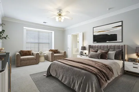 a bedroom with bed and a couch