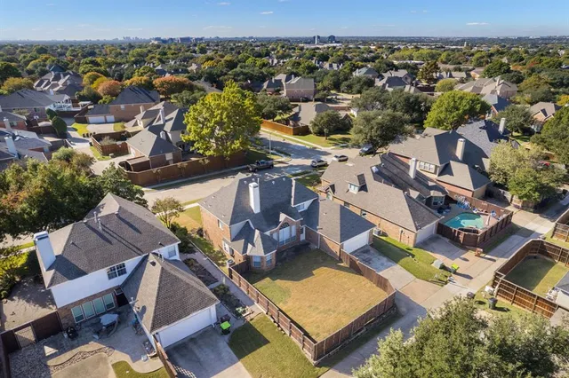 an aerial view of residential houses with outdoor space