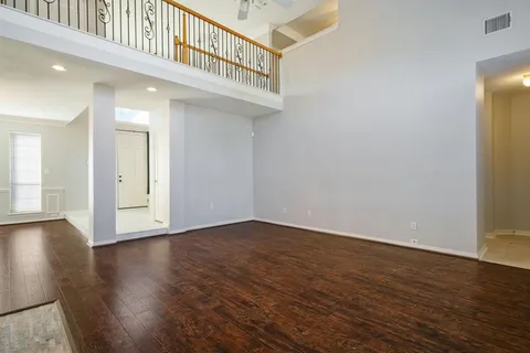 a view of an entryway with wooden floor