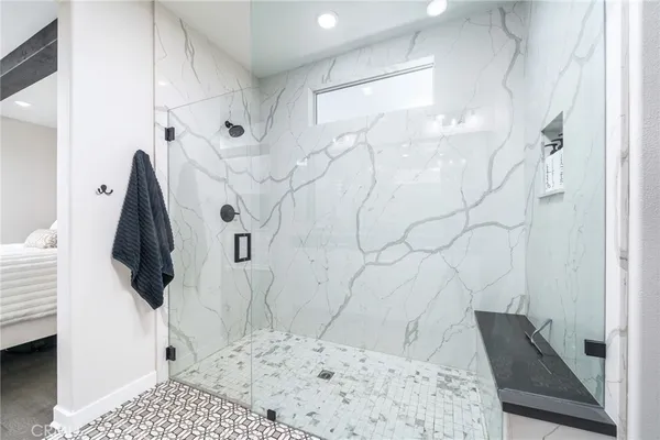 a bathroom with a shower and a sink
