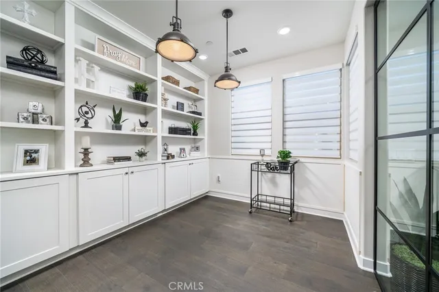 a kitchen with cabinets and window