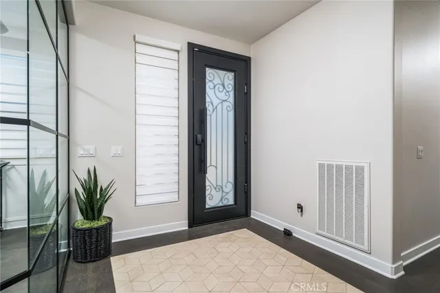 a view of a patio with table and chairs and potted plants
