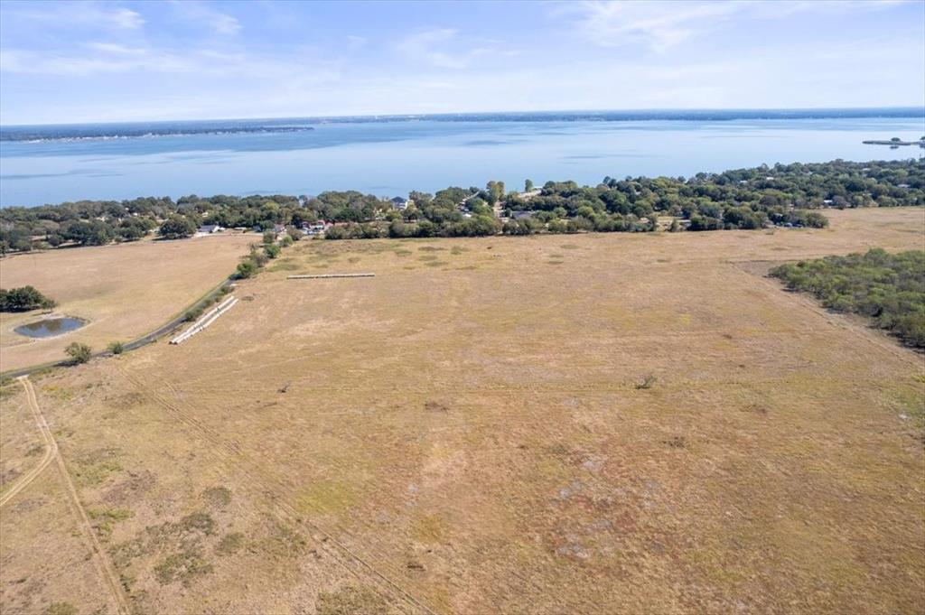 7474 County Road 4042 Kemp, TX 75143 - Photo 3 of 12 a view of a lake and mountain in the back