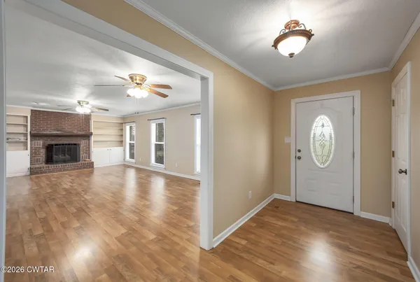 a view of livingroom with kitchen island with wooden floor