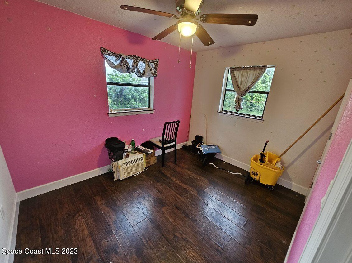4045 Edwards Street Melbourne, FL 32901 - Photo 14 of 19 a living room with furniture and a wooden floor