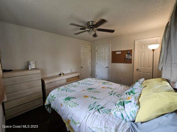 4045 Edwards Street Melbourne, FL 32901 - Photo 17 of 19 a bedroom with a bed and a dresser