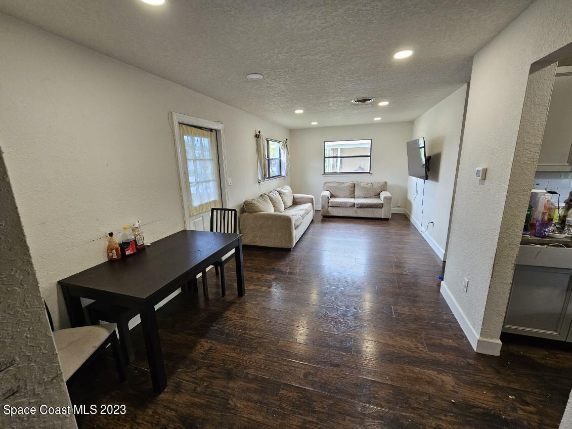 4045 Edwards Street Melbourne, FL 32901 - Photo 4 of 19 a living room with furniture and a wooden floor