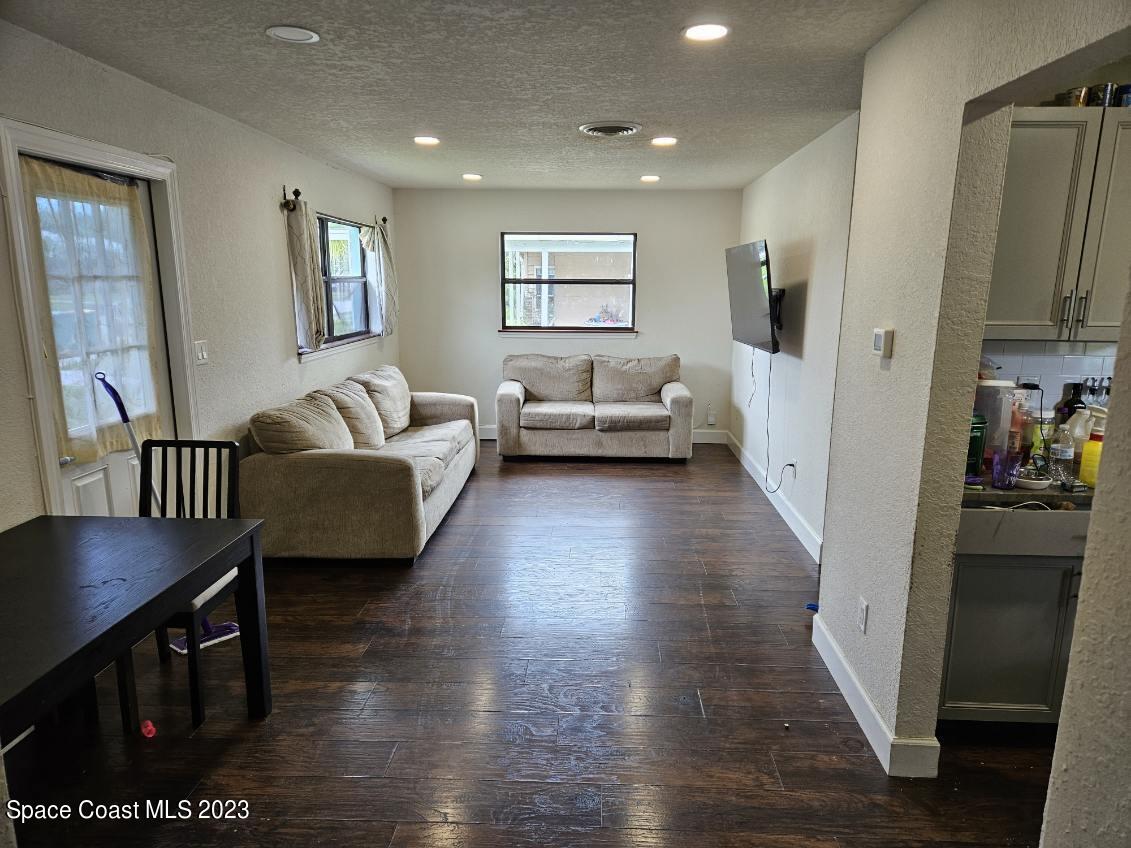 4045 Edwards Street Melbourne, FL 32901 - Photo 5 of 19 a living room with furniture and a wooden floor