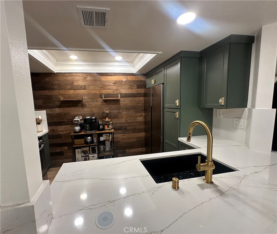 18223 Soledad Canyon Road, Unit 45 Canyon Country, CA 91387 - Photo 16 of 24 a kitchen with stainless steel appliances a sink and counter space