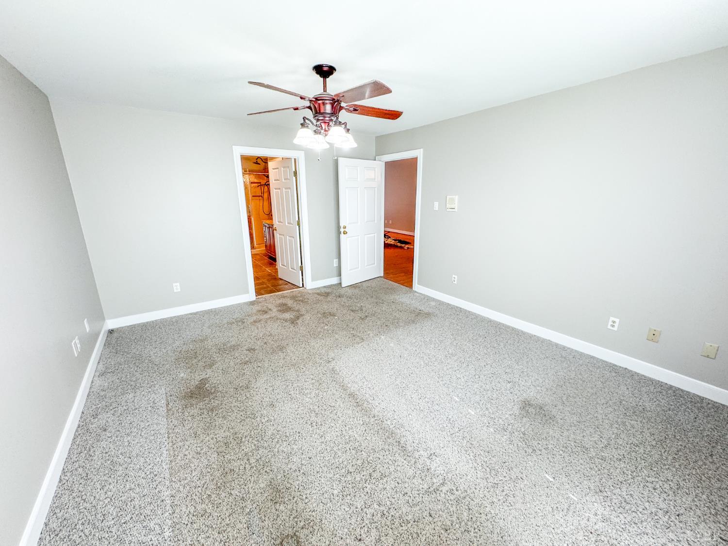 6280 Watchrun Drive Prince George, VA 23875 - Photo 20 of 47 an empty room with a chandelier fan and windows