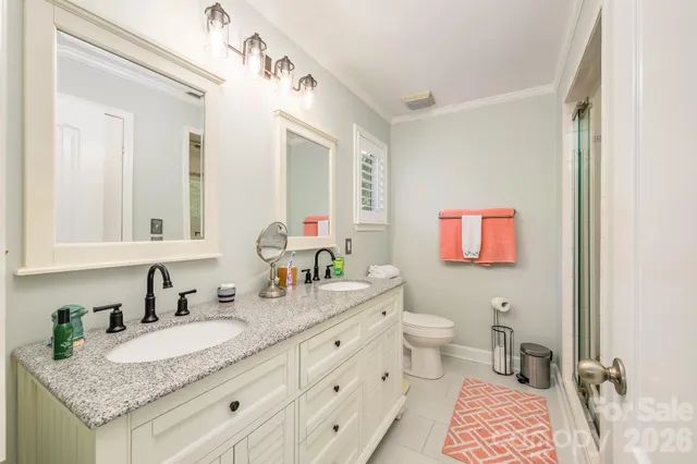 a kitchen with stainless steel appliances granite countertop a refrigerator a stove and a sink