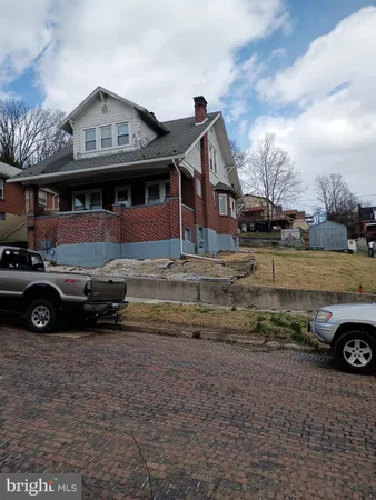 a car parked in front of a house