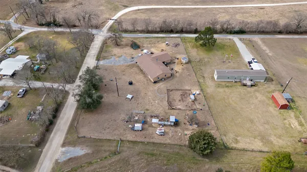 an aerial view of a house with outdoor space