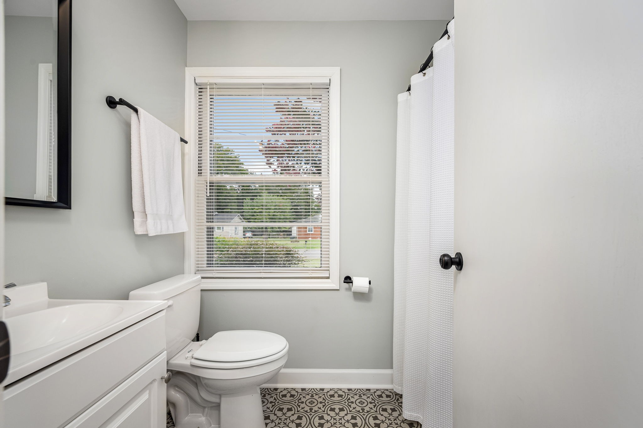 607 Staley Street Murfreesboro, TN 37129 - Photo 14 of 31 a bathroom with a toilet sink and a shower