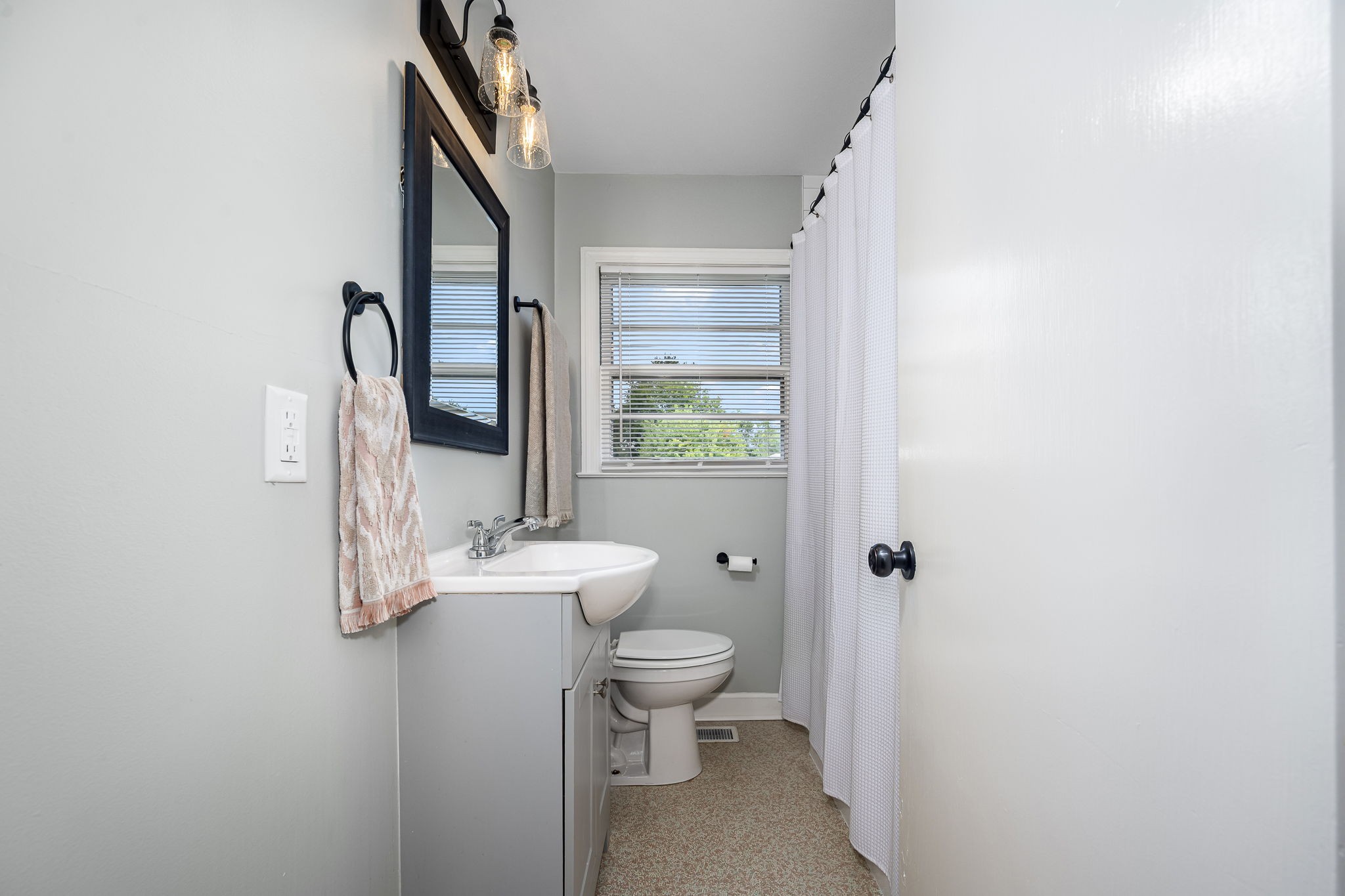 607 Staley Street Murfreesboro, TN 37129 - Photo 22 of 31 a bathroom with a toilet a sink and a mirror