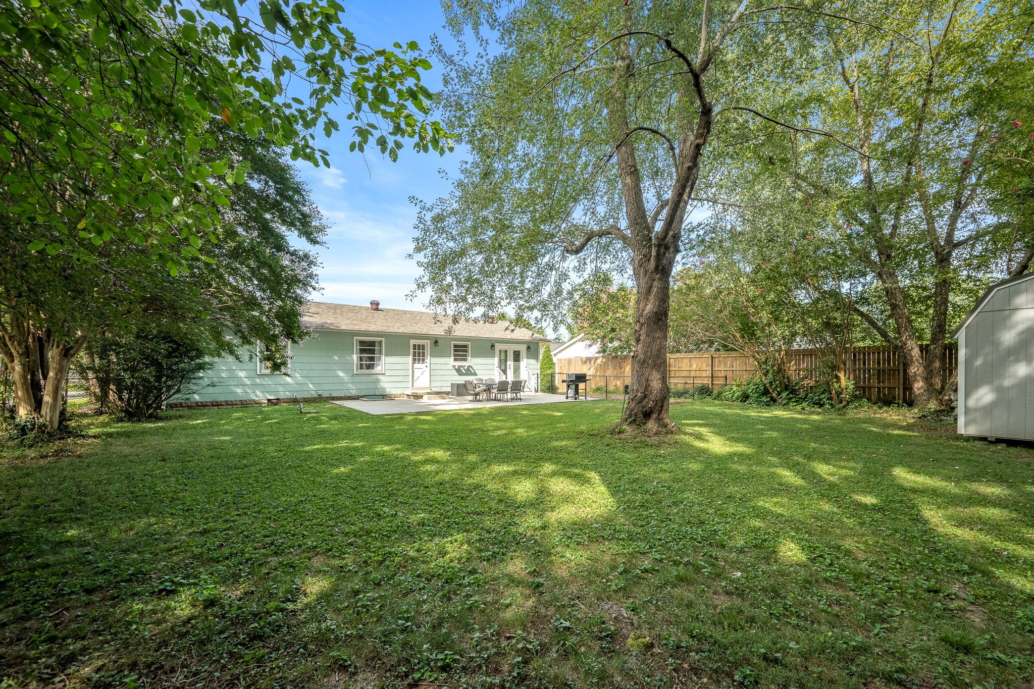 607 Staley Street Murfreesboro, TN 37129 - Photo 28 of 31 a view of backyard with a garden and trees