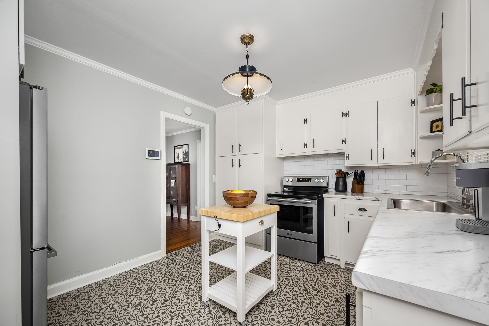 607 Staley Street Murfreesboro, TN 37129 - Photo 10 of 31 a kitchen with stainless steel appliances granite countertop a stove a sink and a refrigerator