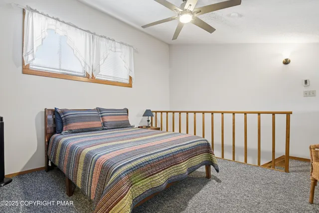 a bed room with a bed and a chandelier