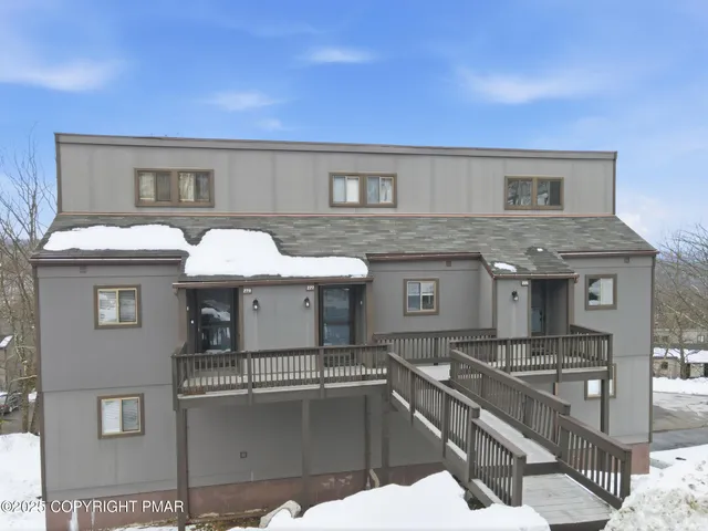 a view of house with roof deck