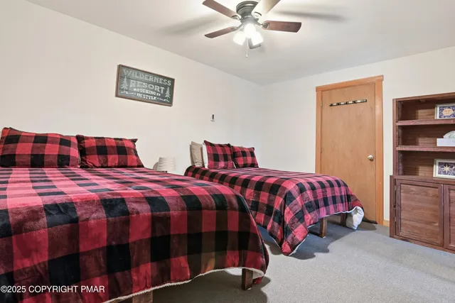 a bedroom with a bed and dresser