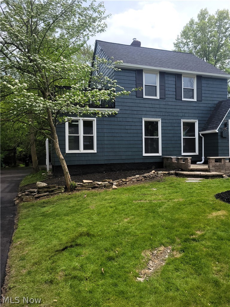1557 Maplegrove Road South Euclid, OH 44121 - Photo 2 of 23 View of front of property featuring a front yard