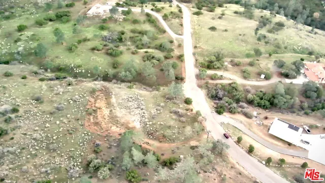 a view of a yard with snow on it