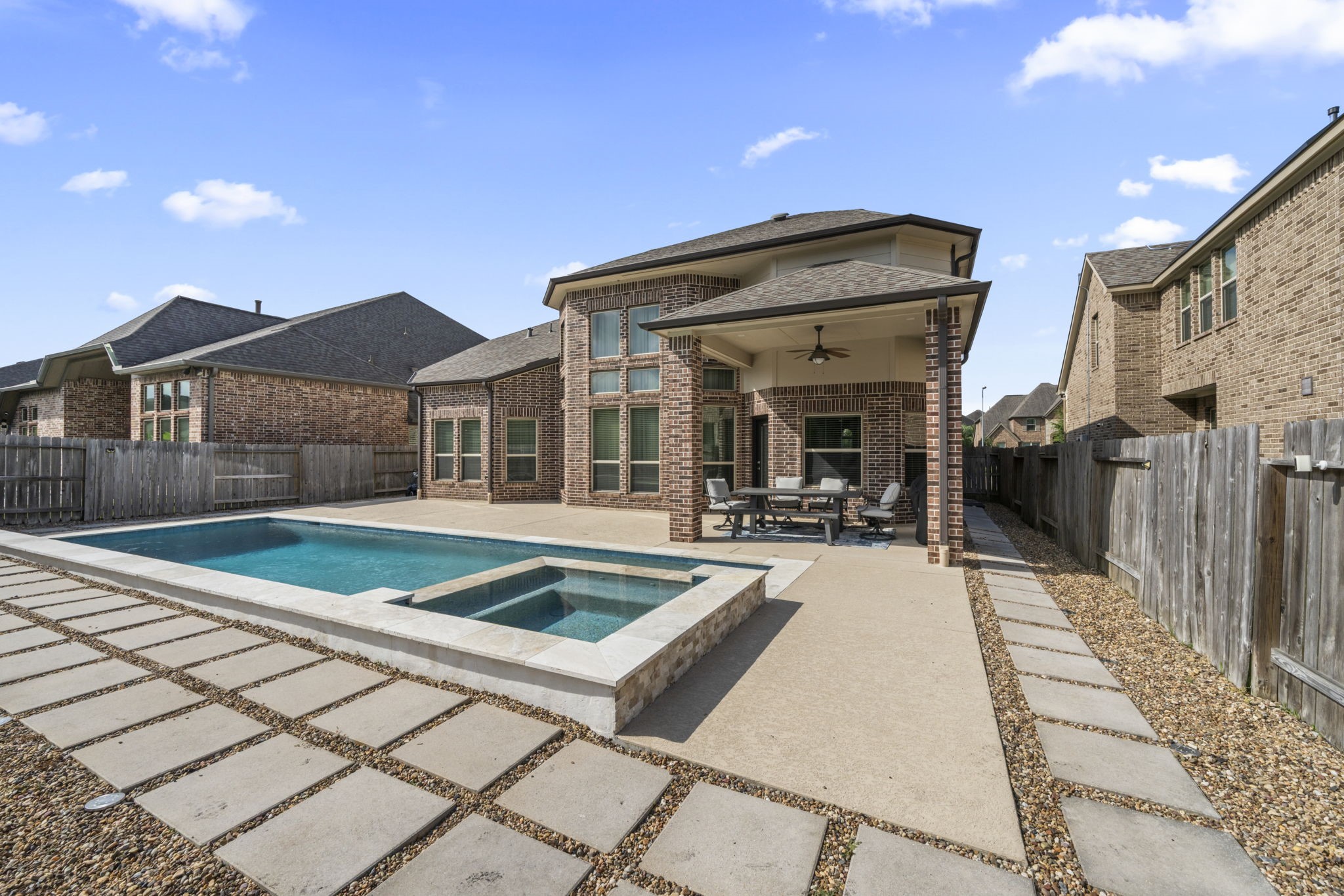 3938 Avalon Ridge Drive Spring, TX 77386 - Photo 2 of 49 Enjoy the sparkling pool and spa with covered patio. Everyone will want to be here for relaxing summer days