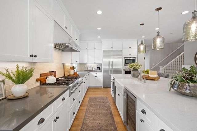 a kitchen with sink and stove
